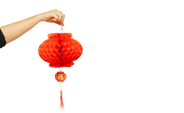 Free Photo happy chinese new year 2020. female hand holding red lantern isolated on white studio background. celebration, decoration, holidays concept. copyspace for your ad.