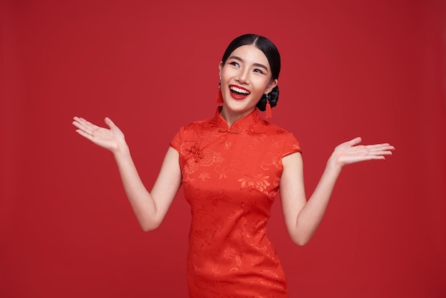 Happy Chinese new year Asian woman wearing traditional cheongsam qipao dress