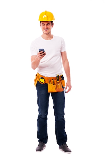 Happy construction worker with smart phone