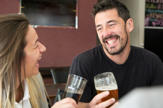 Happy couple enjoying the drinks