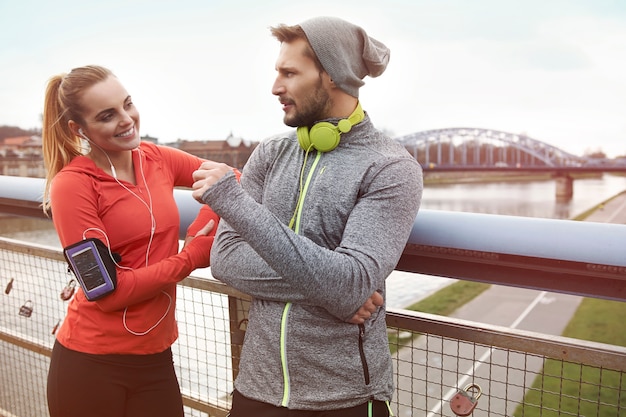 Happy couple exercising outdoors