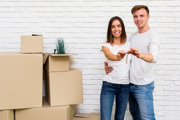 Happy couple holding house keys