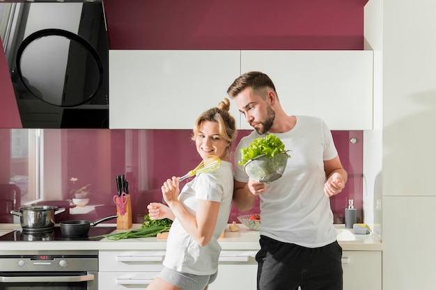 Happy couple indoors in the kitchen