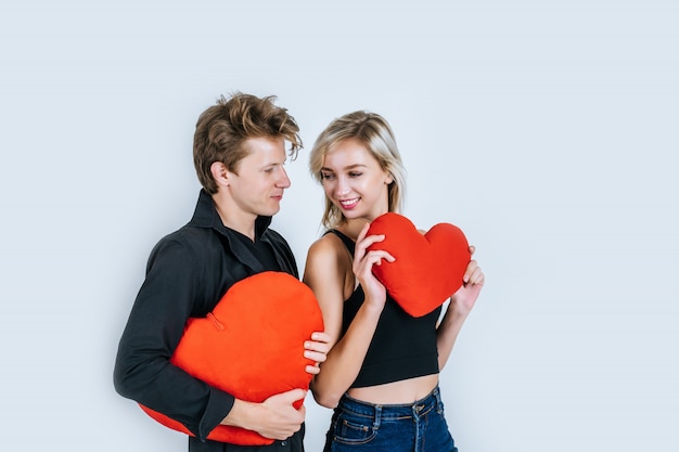 Free Photo happy couple loving together holding a red heart 