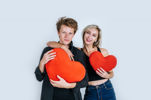 Free Photo happy couple loving together holding a red heart 