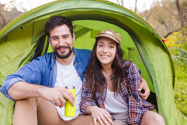 Happy couple near tent