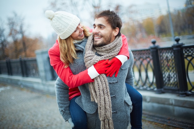 Free Photo happy couple piggybacking