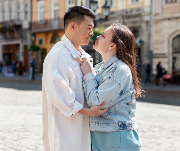 Happy couple posing together outdoors