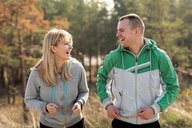 Free photo happy couple running togeter in nature