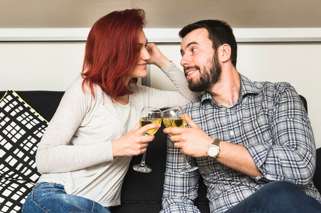 Happy couple toasting wineglasses