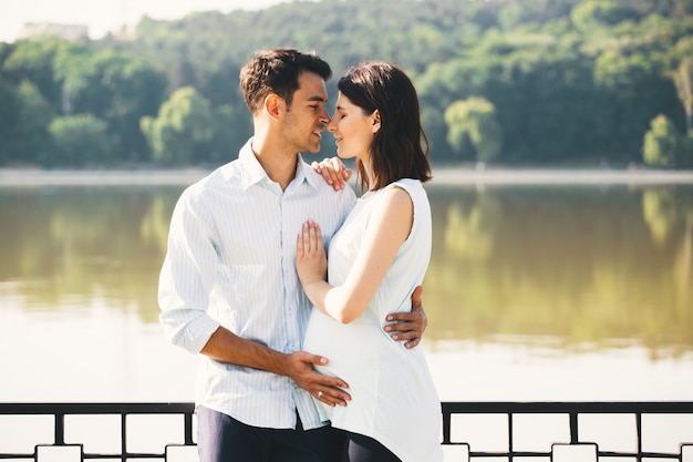 Happy couple waiting a baby, anticipating parent role