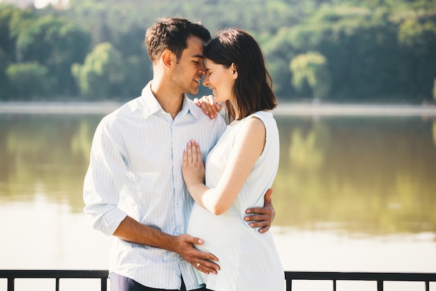 Happy couple waiting a baby, anticipating parent role