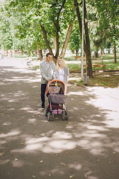 Happy couple walking their baby