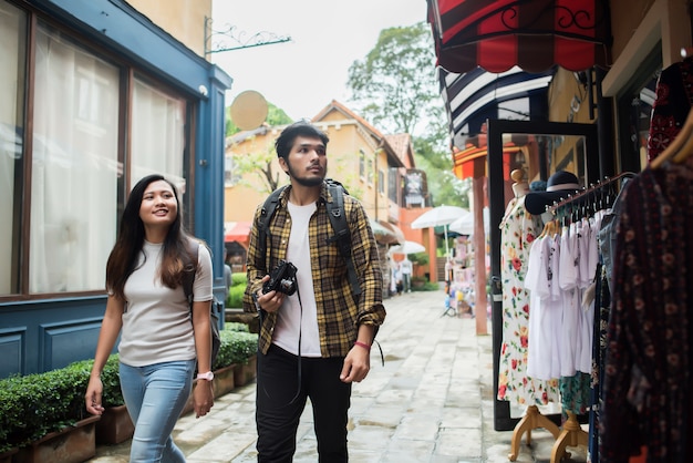 Happy couple walking in urban ,Young adults tourists on travel urban walking together.