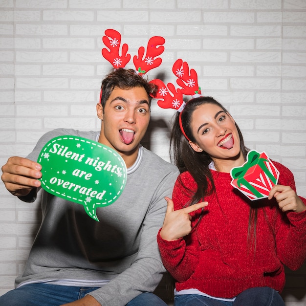 Free Photo happy couple with christmas stickers 