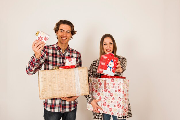 Happy couple with present boxes