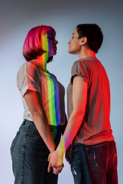 Free photo happy couple of women posing together