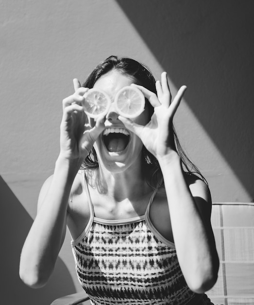 Free photo happy cute girl with oranges