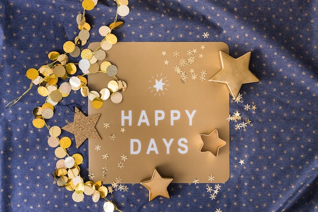 Free photo happy days inscription on paper with stars