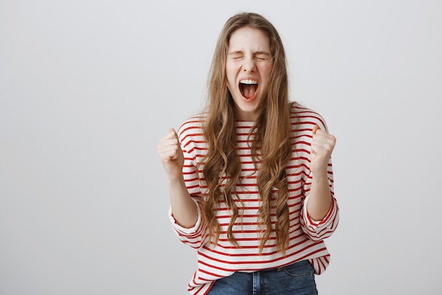 Free Photo happy excited girl becoming champion, winning competition