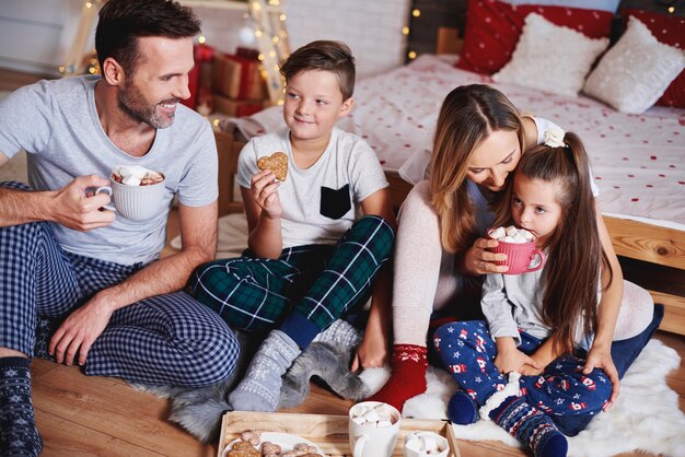 Happy family celebrating Christmas together at home