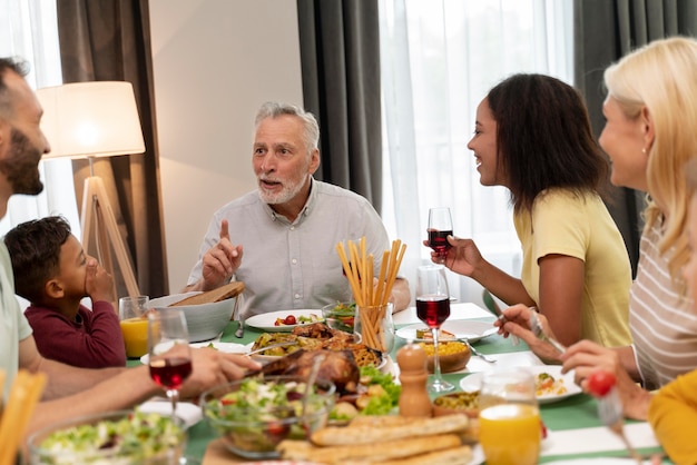 Happy family havinf dinner together