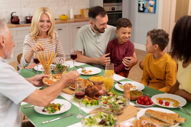 Happy family havinf dinner together