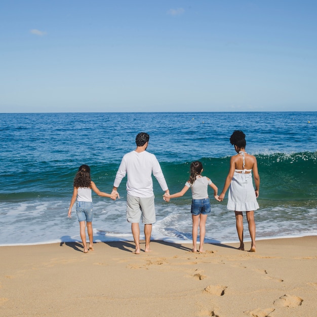 Happy family holding hands