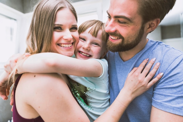 Free photo happy family hugging in bathroom