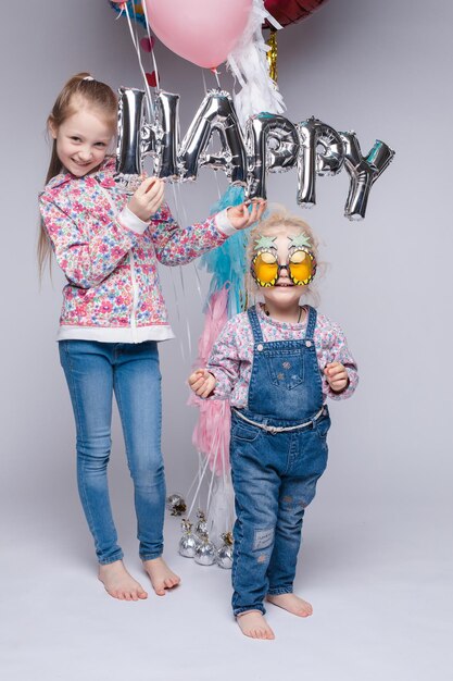 Happy family posing while celebrating birthday party