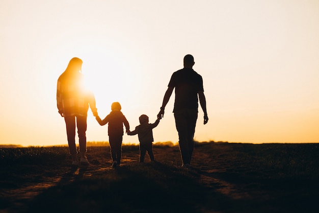 Happy family silhouette on the sunset