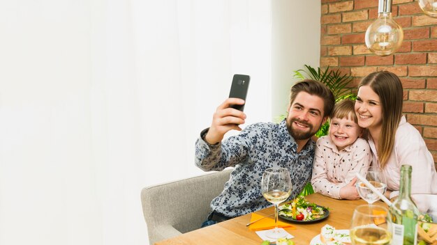 Happy family taking selfie together