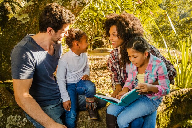 Happy family under a tree