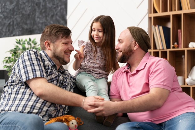 Free Photo happy family of two dads and a baby