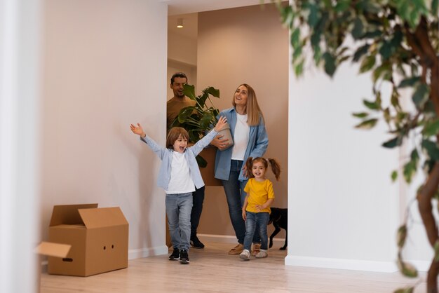 Happy family with dog moving in new home