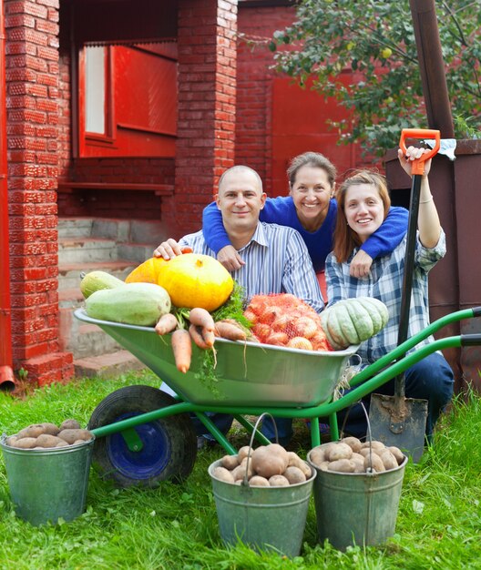 Happy  family with vegetables harvest