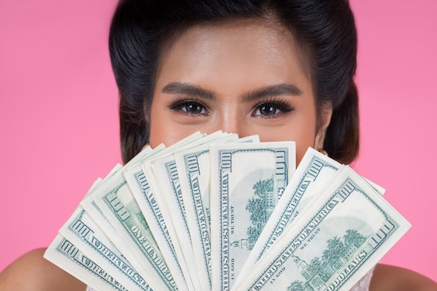 Happy Fashion beautiful woman hand holding dollar money