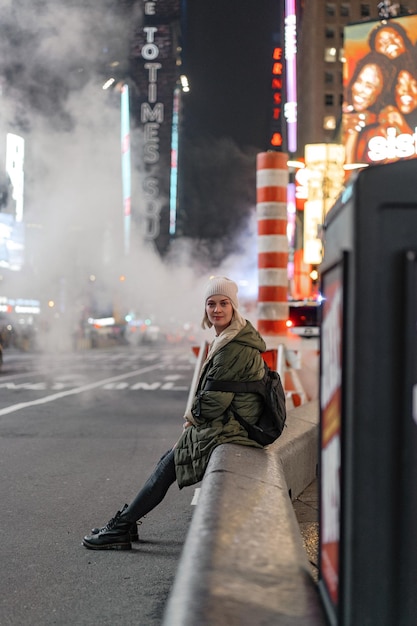 Free photo happy fashion woman excited to be in times square, nyc