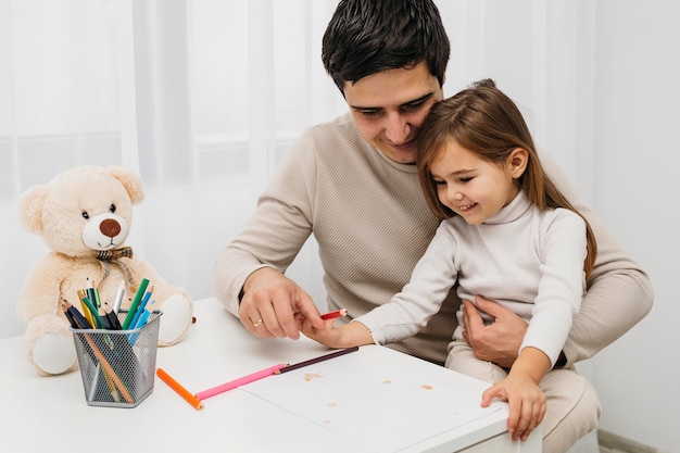 Free photo happy father and daughter at home together