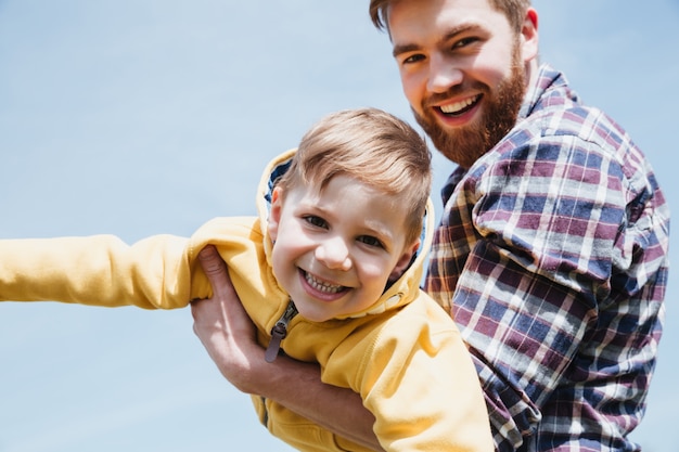 Free photo happy father and his little son having fun together