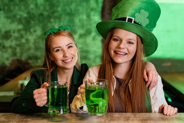 Free photo happy female friends celebrating st. patrick's day together