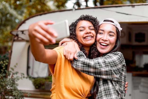 Happy female friends hugging each other