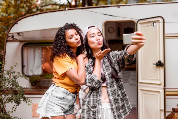 Happy female friends taking a self photo