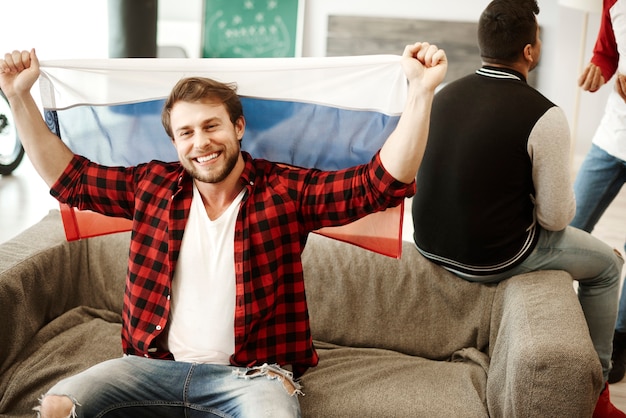 Free Photo happy football fans waving a russian flag