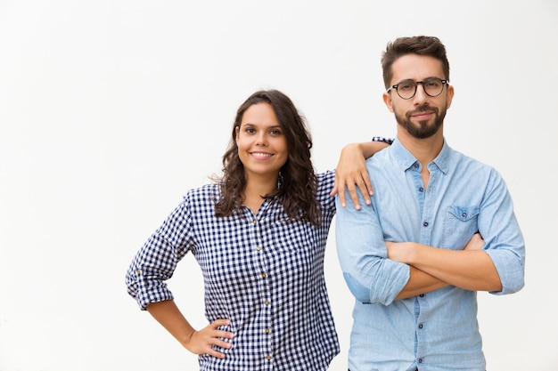 Happy friendly family couple posing together