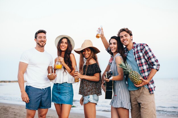 Happy friends celebrating at the beach