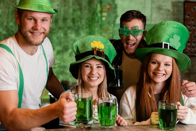 Free photo happy friends celebrating together st. patrick's day