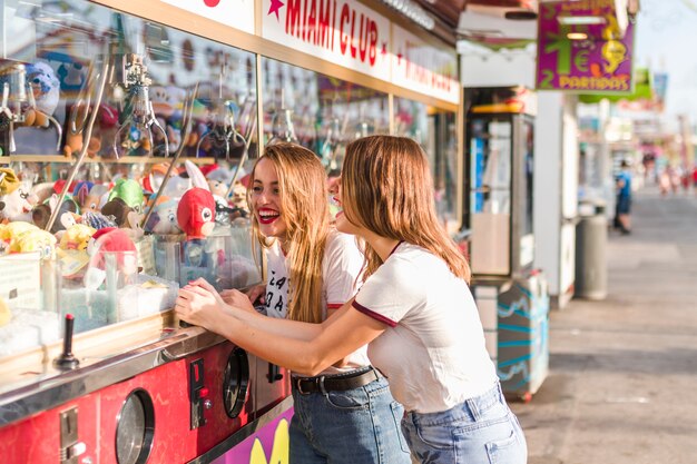 Free Photo happy friends having fun in the amusement park