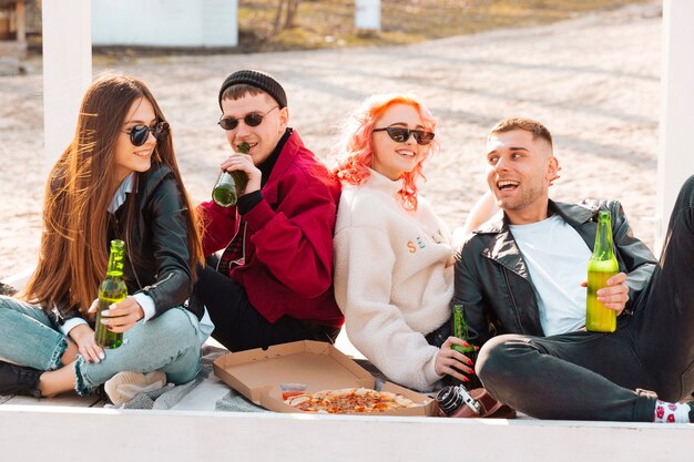 Happy friends having fun together at open-air party