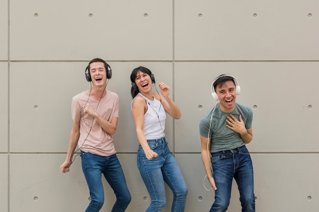 Happy friends listening to music